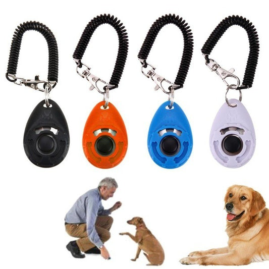 Four dog training clickers in black, orange, blue, and white with a man and dogs on a white background.