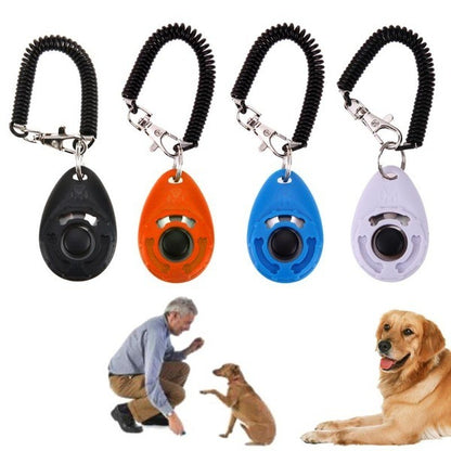 Four dog training clickers in black, orange, blue, and white with a man and dogs on a white background.